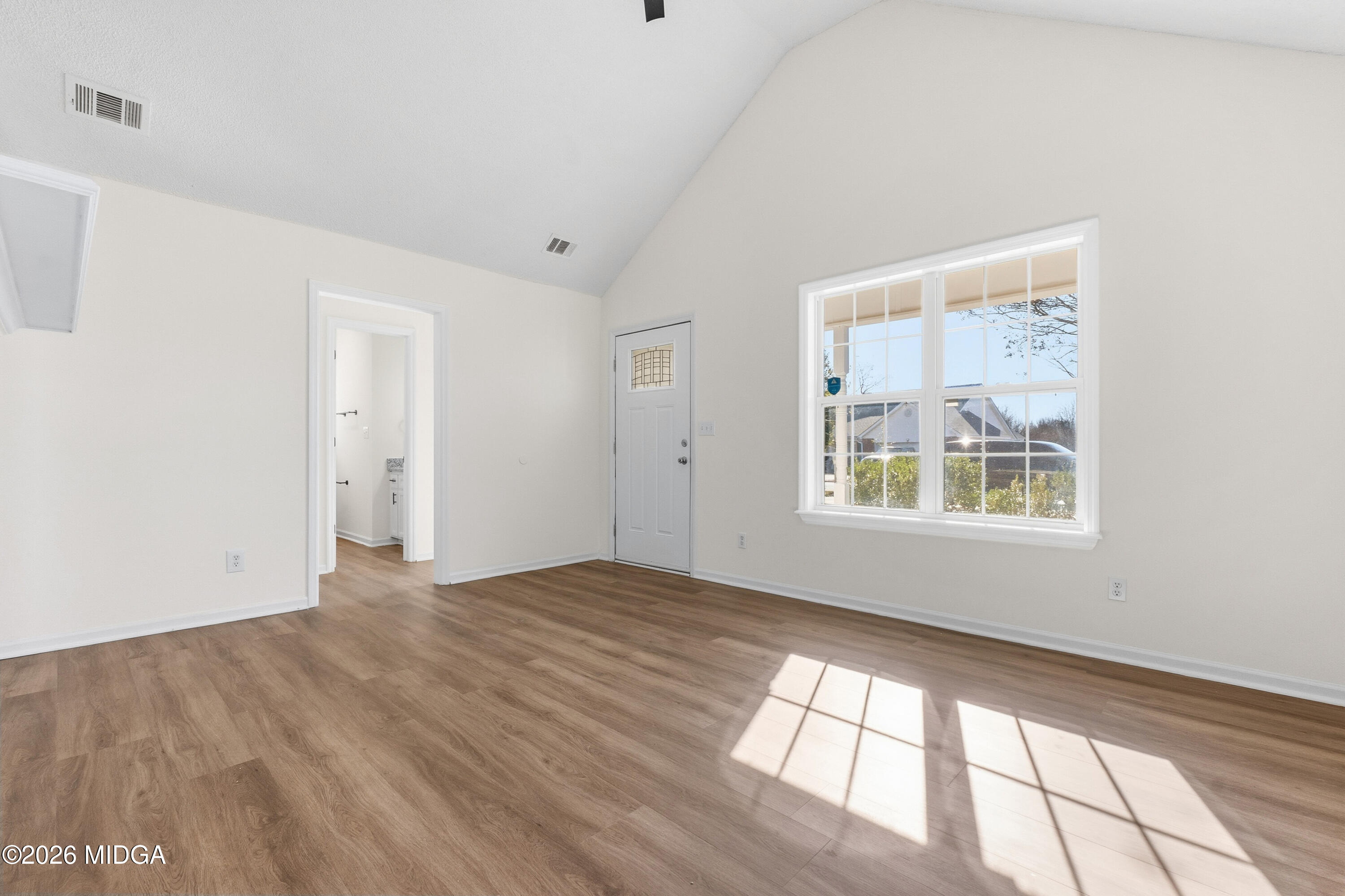 404 Wynfield Lane Bonaire, GA 31005 - Photo 6 of 45 a view of an empty room with a window