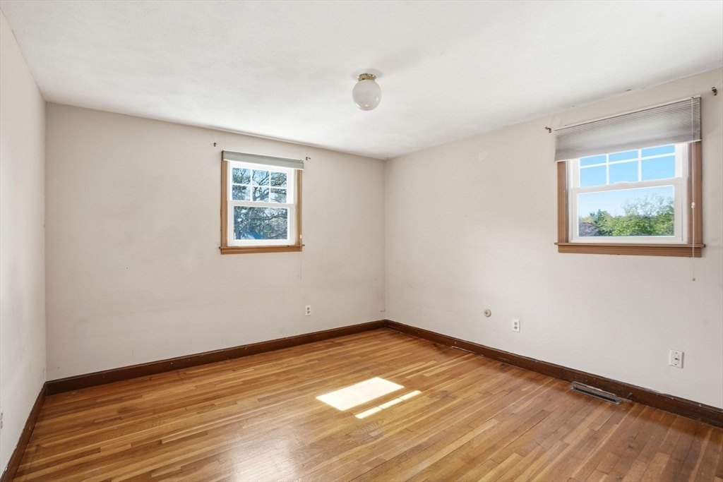 3 Fairway Drive Canton, MA 02021 - Photo 16 of 34 a view of empty room with wooden floor and fan