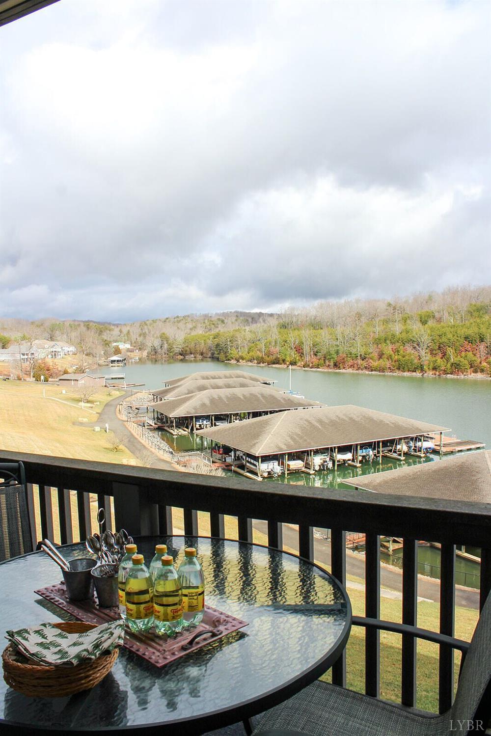1019 Mariners Way, Unit 30 Huddleston, VA 24104 - Photo 4 of 48 a view of swimming pool with a table and chairs in the ocean