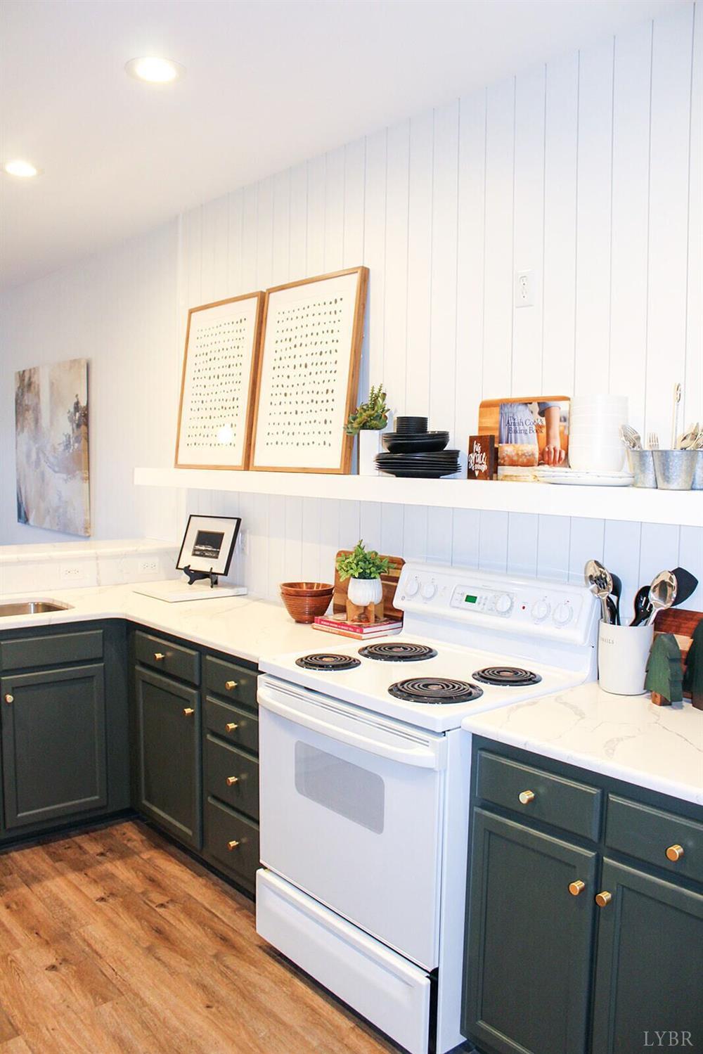 1019 Mariners Way, Unit 30 Huddleston, VA 24104 - Photo 8 of 48 a kitchen with a cabinets window and white appliances