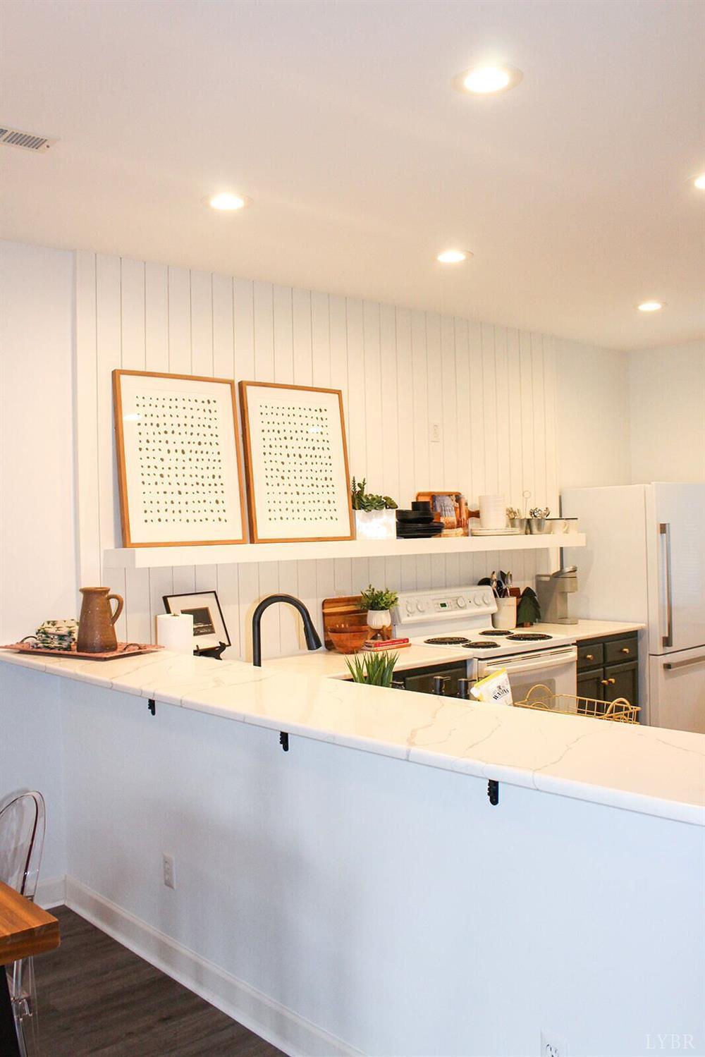 1019 Mariners Way, Unit 30 Huddleston, VA 24104 - Photo 9 of 48 a kitchen with a sink and cabinets