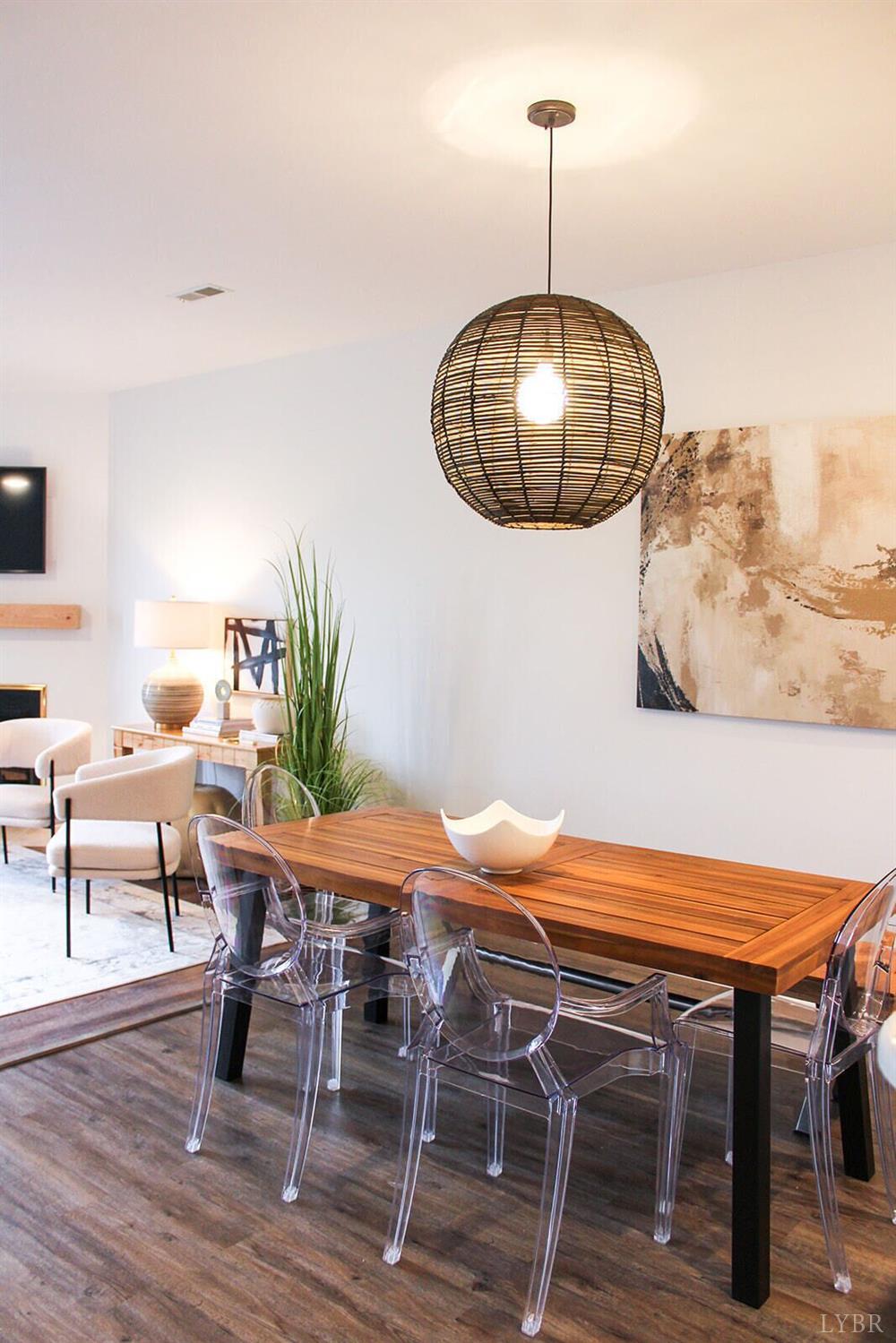 1019 Mariners Way, Unit 30 Huddleston, VA 24104 - Photo 10 of 48 a view of a dining room with furniture and wooden floor
