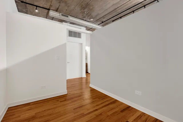 a view of a small space with wooden floor