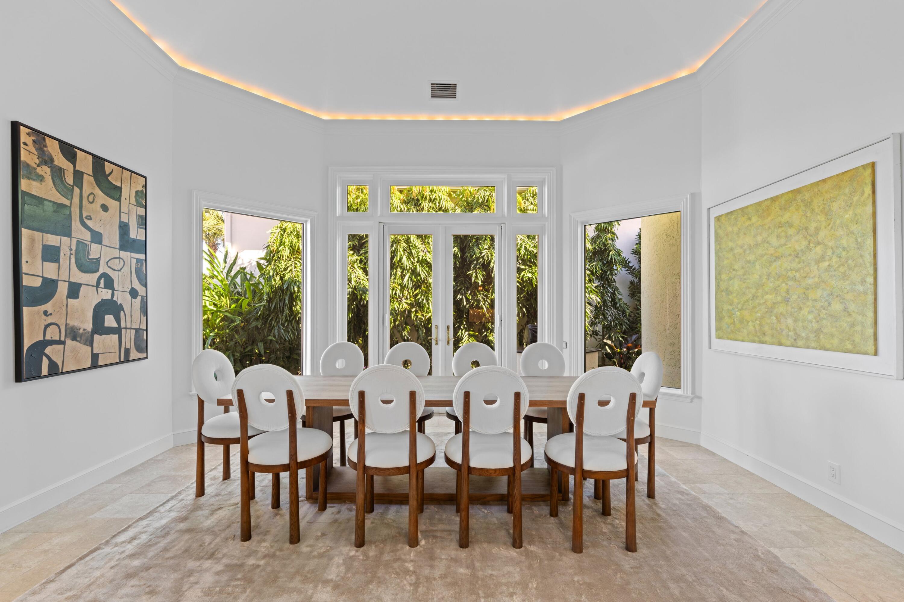 123 Terrapin Trail Jupiter, FL 33458 - Photo 19 of 63 a view of a dining room with furniture and windows