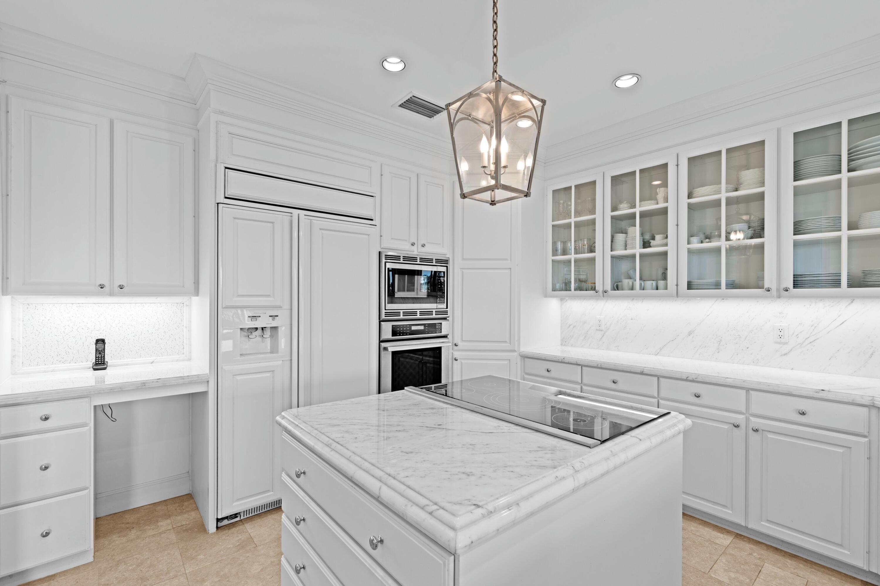 123 Terrapin Trail Jupiter, FL 33458 - Photo 21 of 63 a kitchen with a sink stainless steel appliances and chandelier