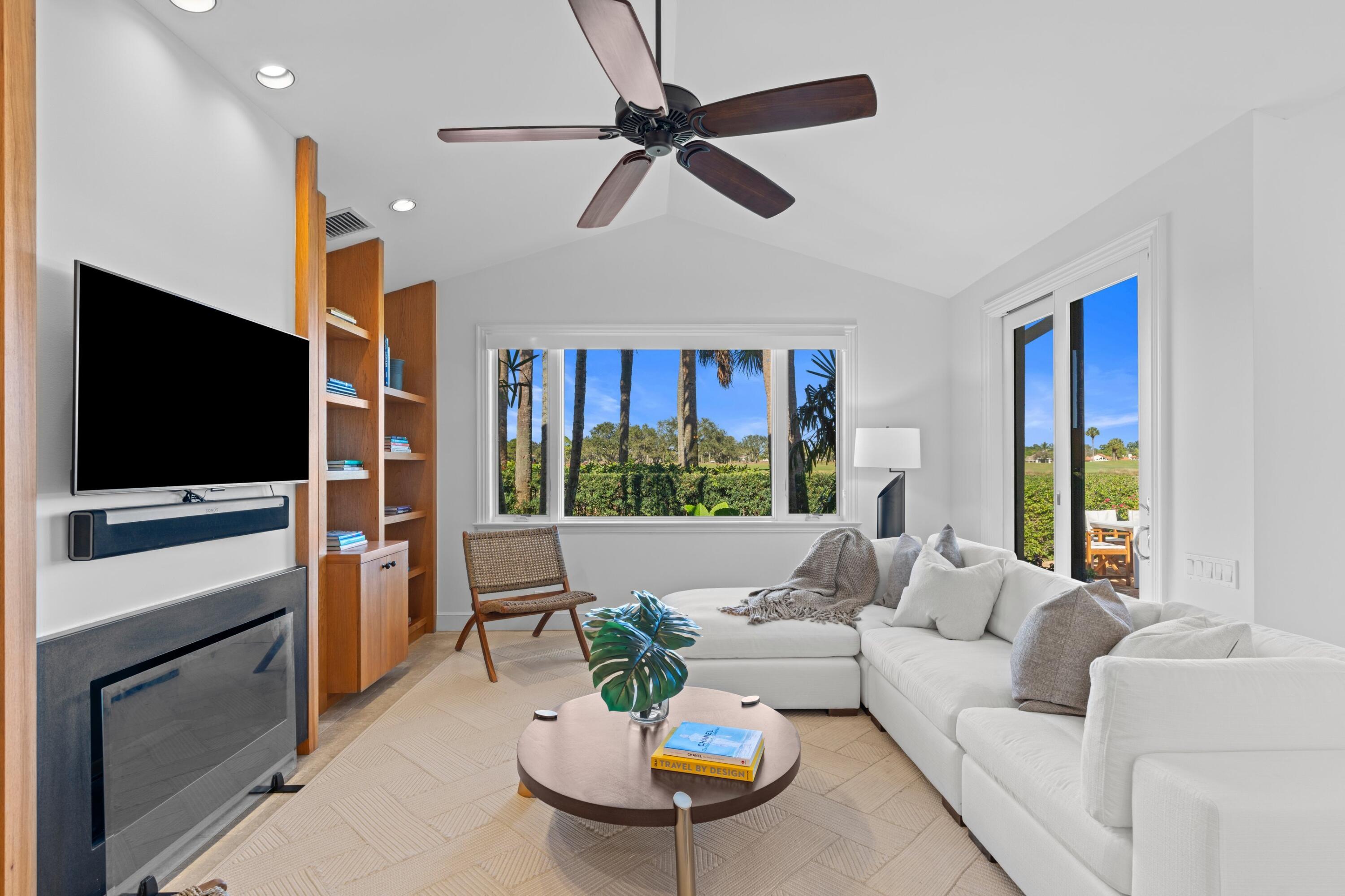 123 Terrapin Trail Jupiter, FL 33458 - Photo 24 of 63 a living room with furniture a flat screen tv and a large window