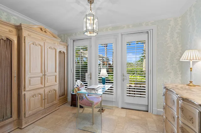 an aerial view of a residential houses with outdoor space and ocean view