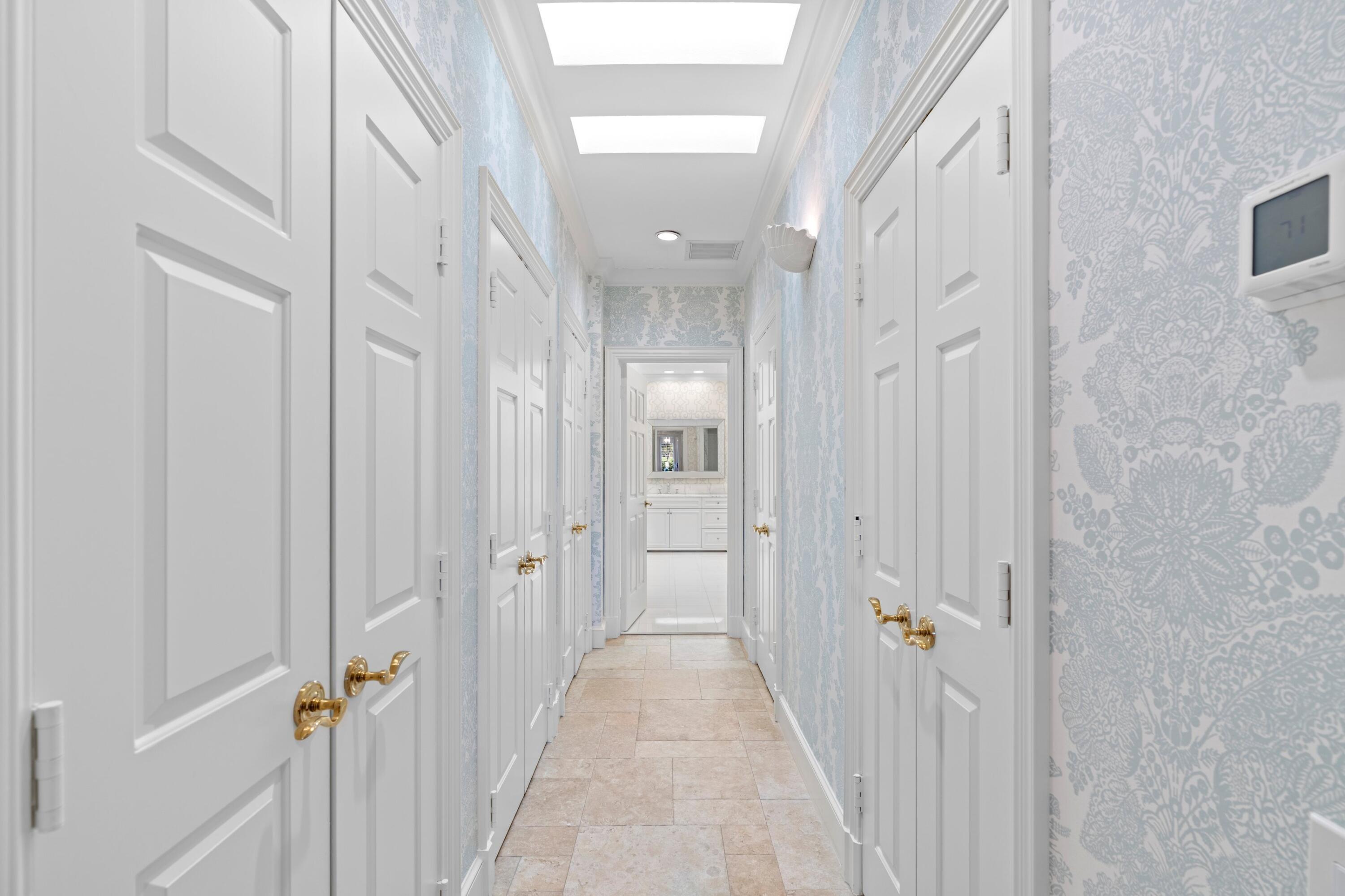 123 Terrapin Trail Jupiter, FL 33458 - Photo 27 of 63 a view of a hallway with a chandelier