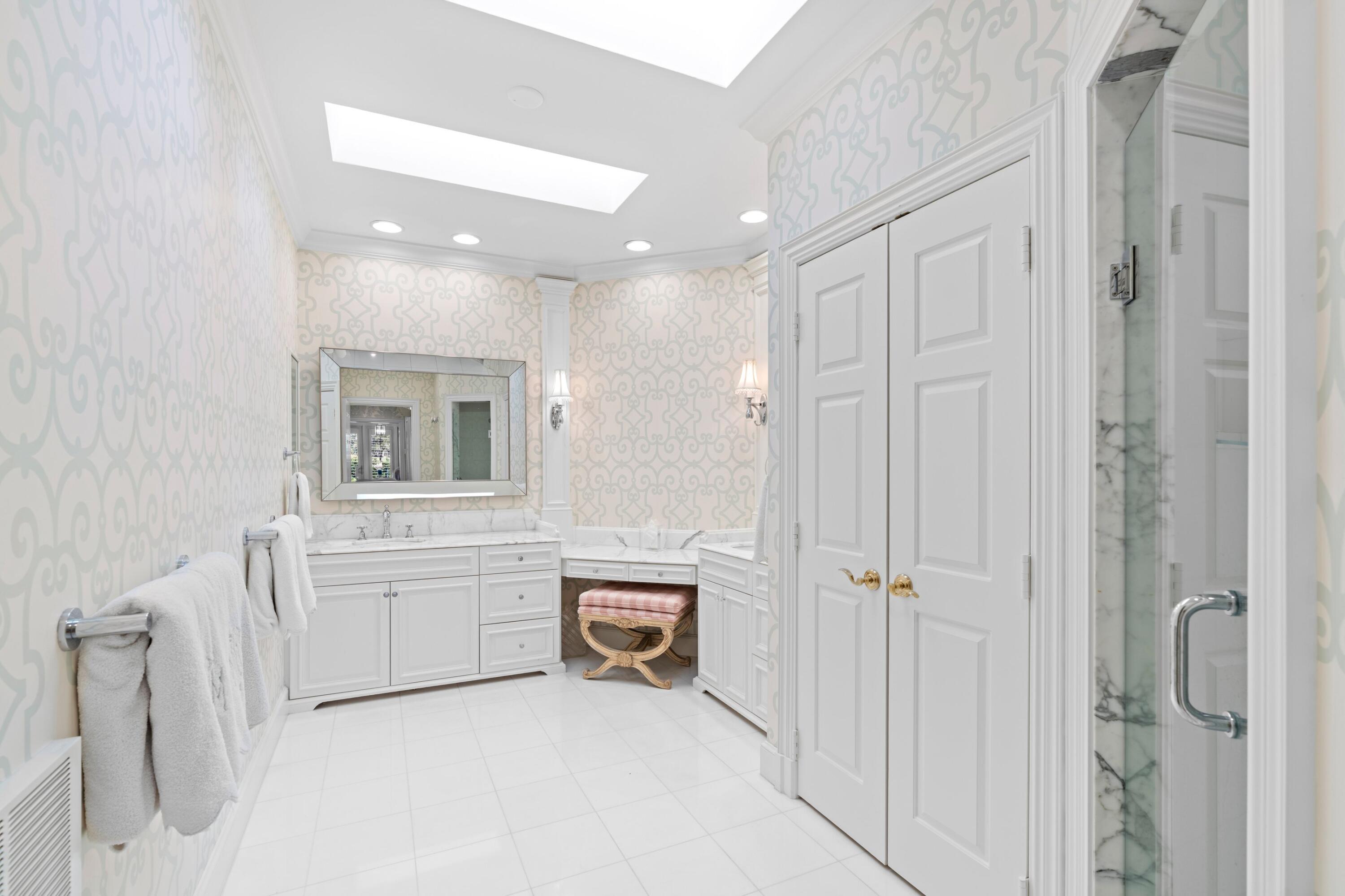 123 Terrapin Trail Jupiter, FL 33458 - Photo 28 of 63 a spacious bathroom with a mirror vanity and bathtub