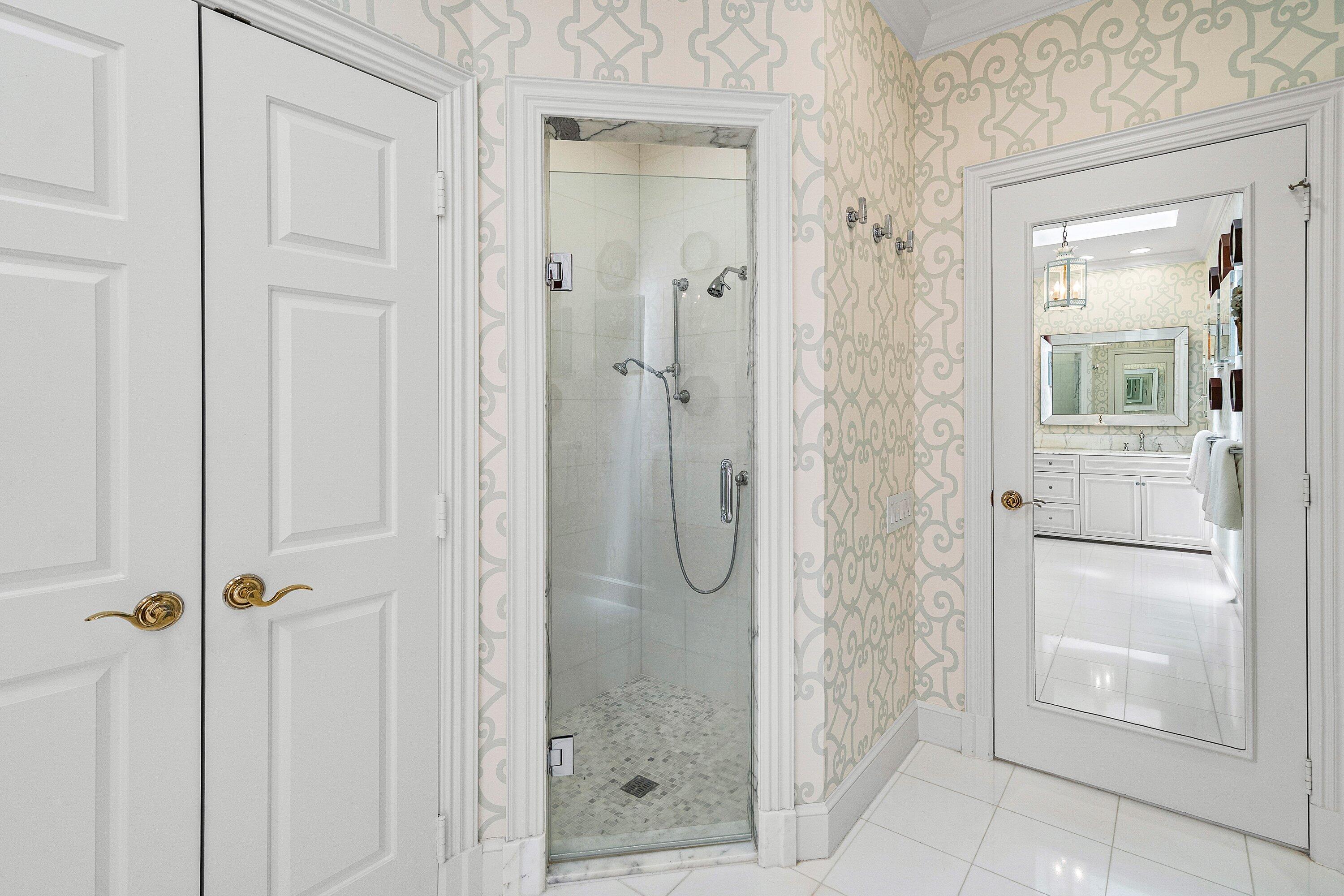 123 Terrapin Trail Jupiter, FL 33458 - Photo 29 of 63 a bathroom with a glass shower door