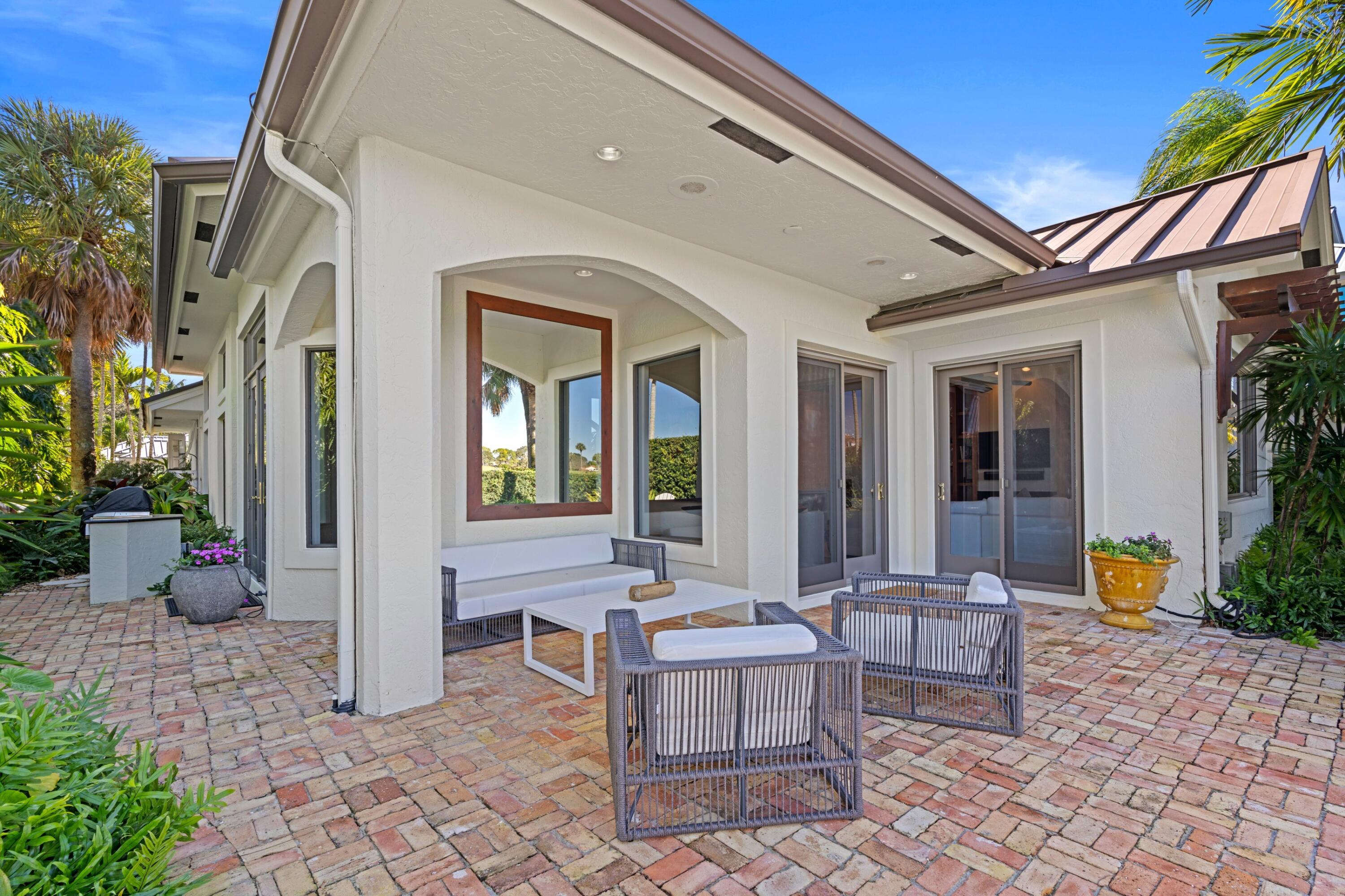 123 Terrapin Trail Jupiter, FL 33458 - Photo 37 of 63 a building outdoor space with patio furniture and potted plants