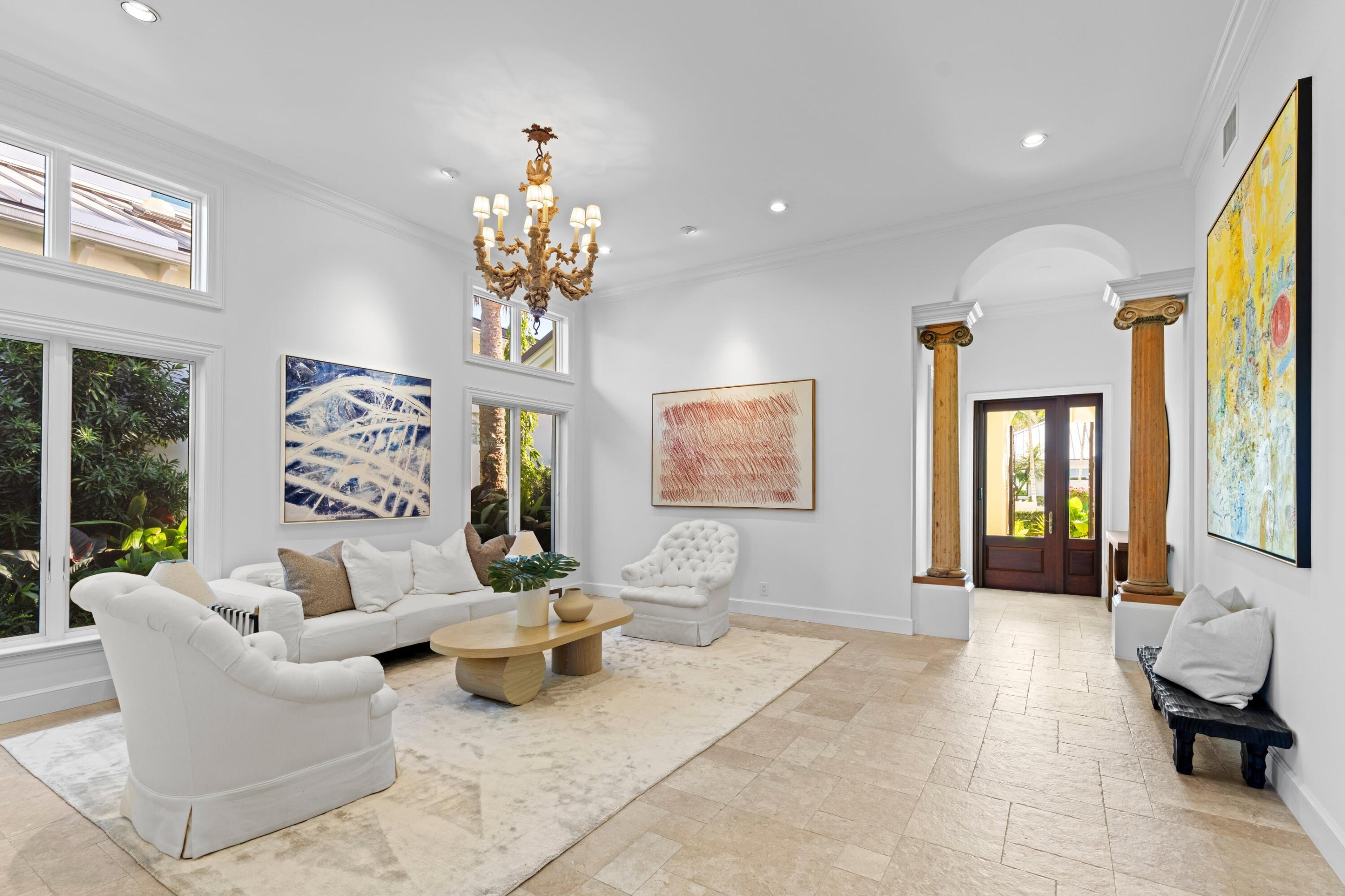 123 Terrapin Trail Jupiter, FL 33458 - Photo 5 of 63 a living room with patio furniture and a chandelier