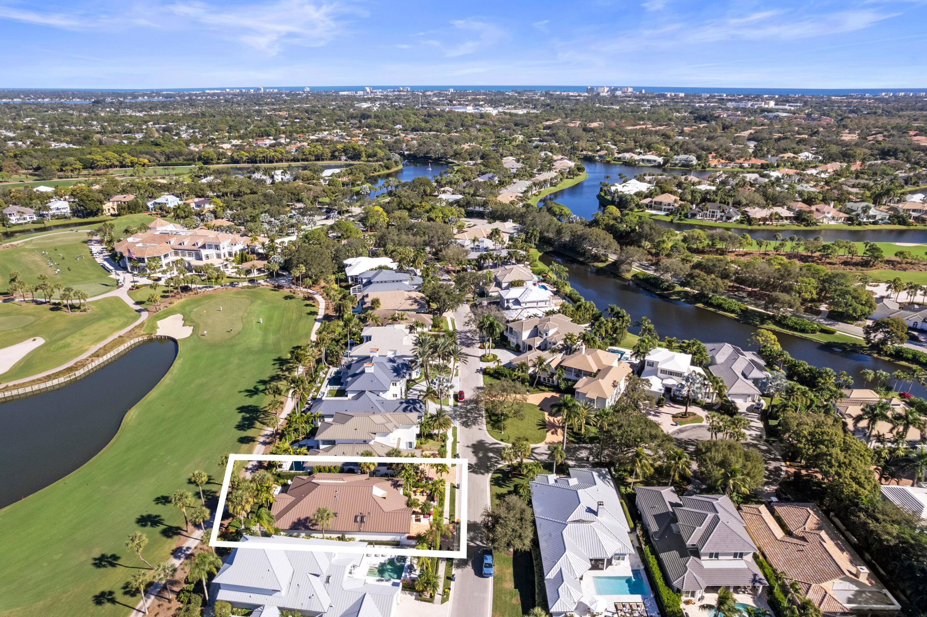 123 Terrapin Trail Jupiter, FL 33458 - Photo 60 of 63 an aerial view of residential building and lake