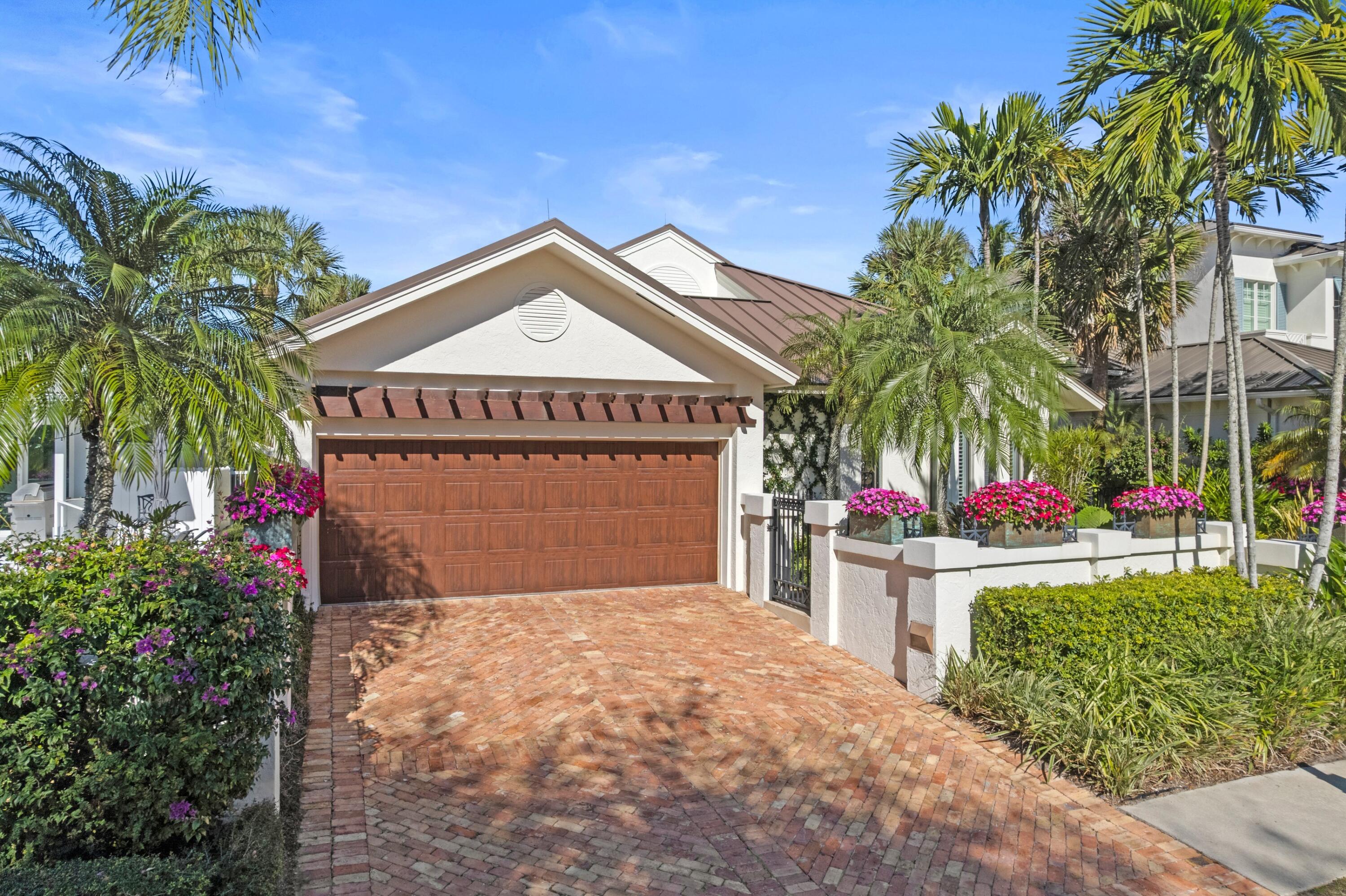 123 Terrapin Trail Jupiter, FL 33458 - Photo 6 of 63 a front view of a house with garden