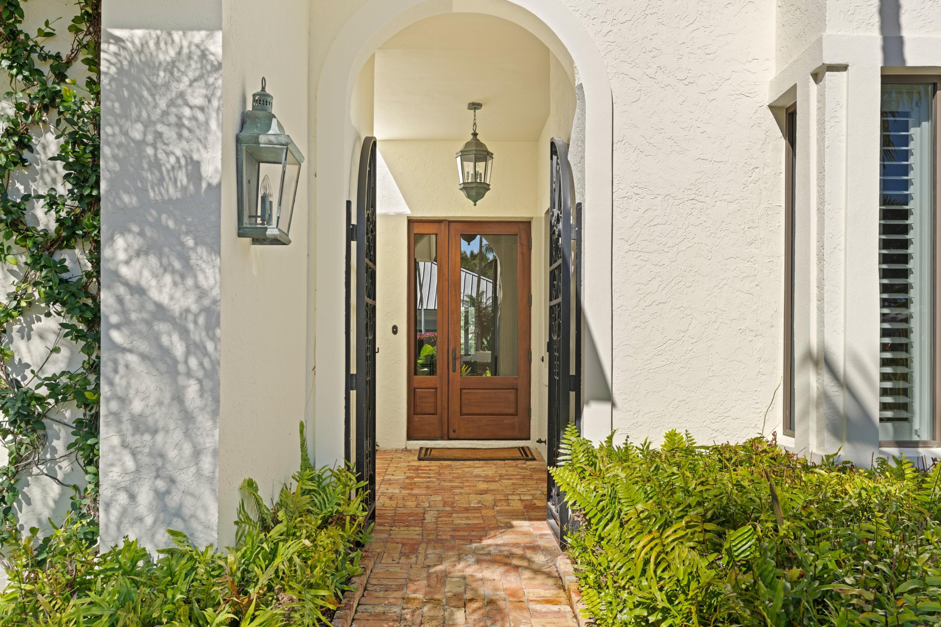 123 Terrapin Trail Jupiter, FL 33458 - Photo 10 of 63 a front view of a house with a garden