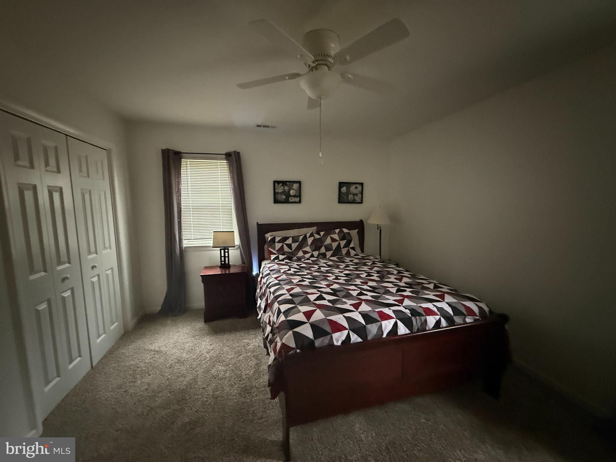 11305 River Road Ridgely, MD 21660 - Photo 12 of 14 a bedroom with a bed and window