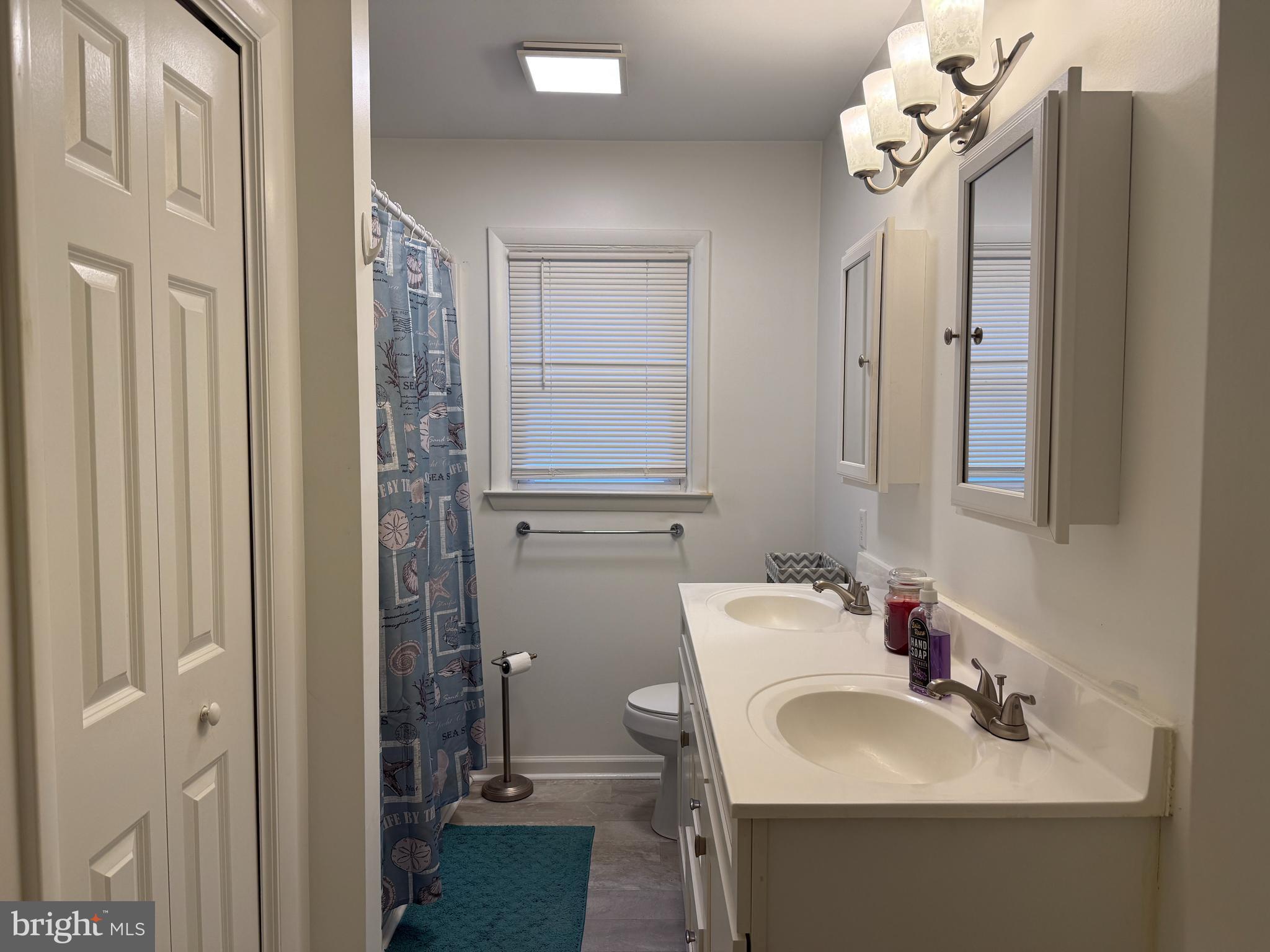 11305 River Road Ridgely, MD 21660 - Photo 8 of 14 a bathroom with a sink vanity and mirror