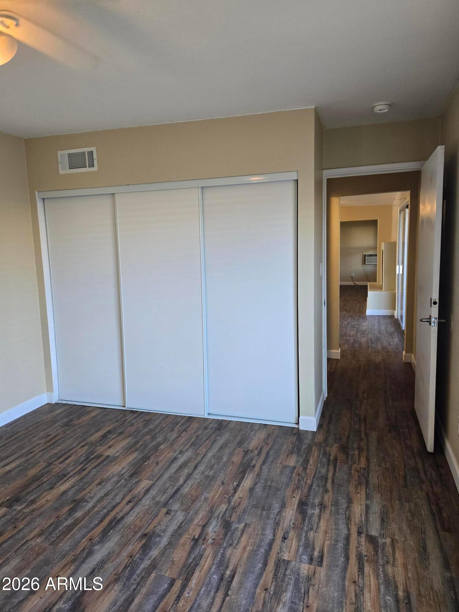 9002 West Roma Avenue Phoenix, AZ 85037 - Photo 11 of 29 a view of a room with wooden floor