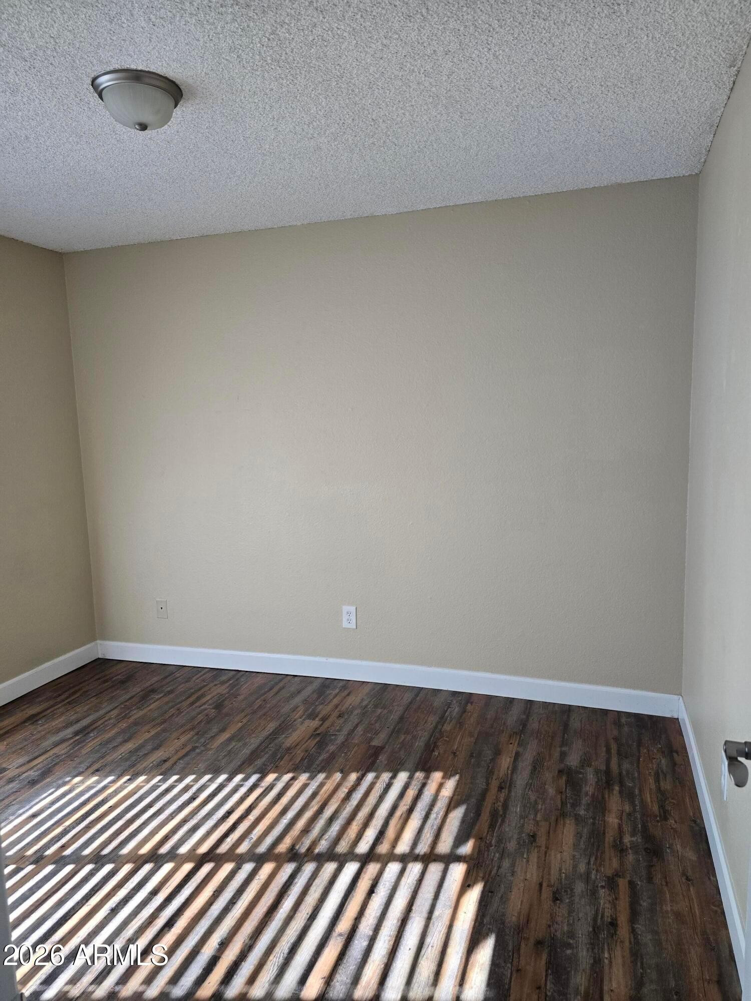 9002 West Roma Avenue Phoenix, AZ 85037 - Photo 13 of 29 a view of wooden floor