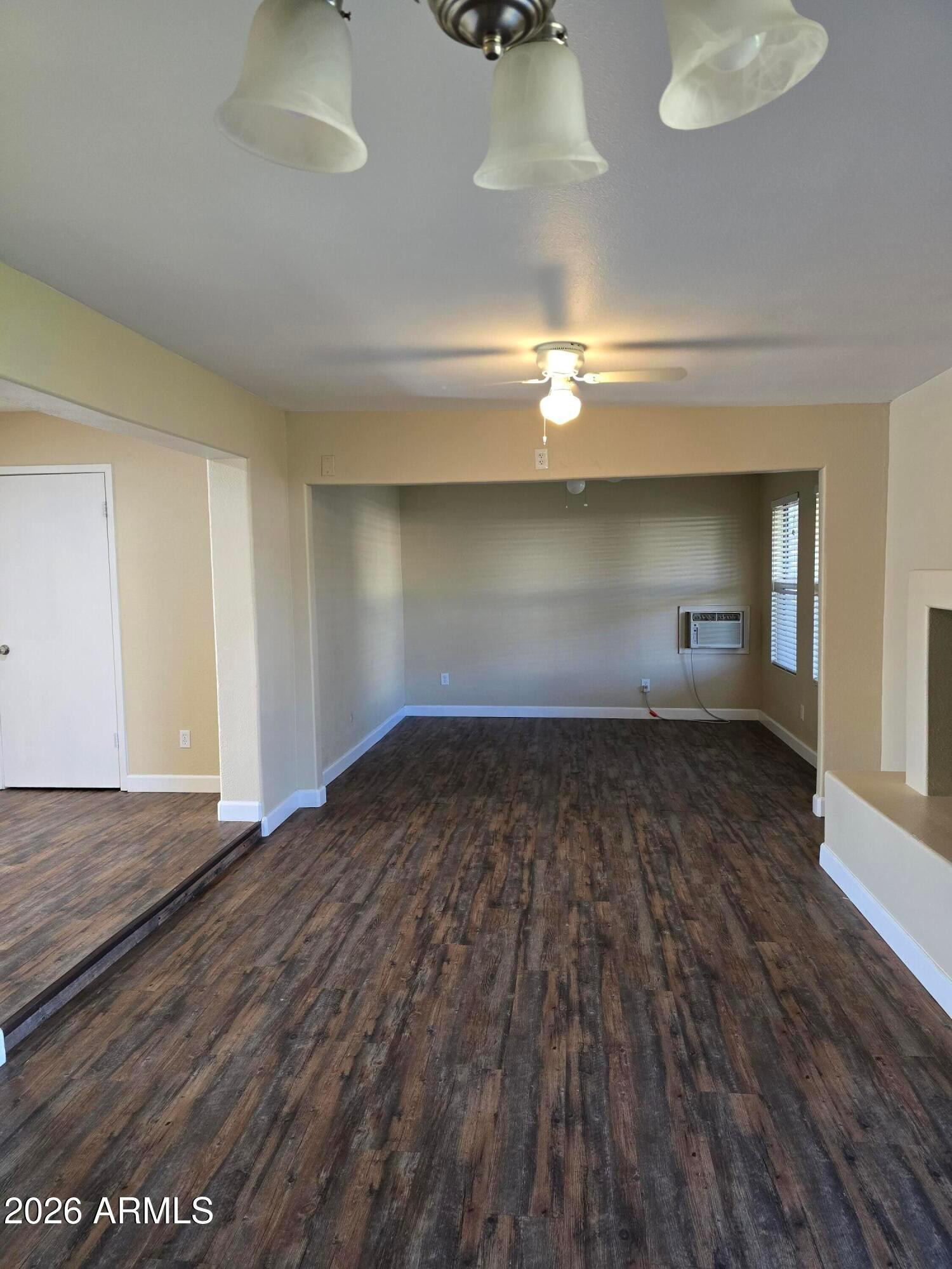 9002 West Roma Avenue Phoenix, AZ 85037 - Photo 18 of 29 a view of empty room with wooden floor