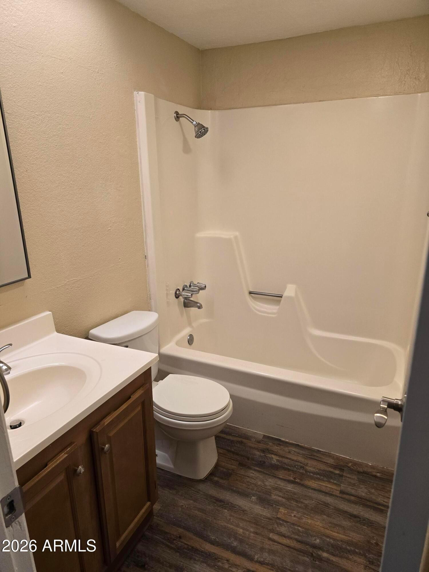 9002 West Roma Avenue Phoenix, AZ 85037 - Photo 20 of 29 a bathroom with a sink and a mirror