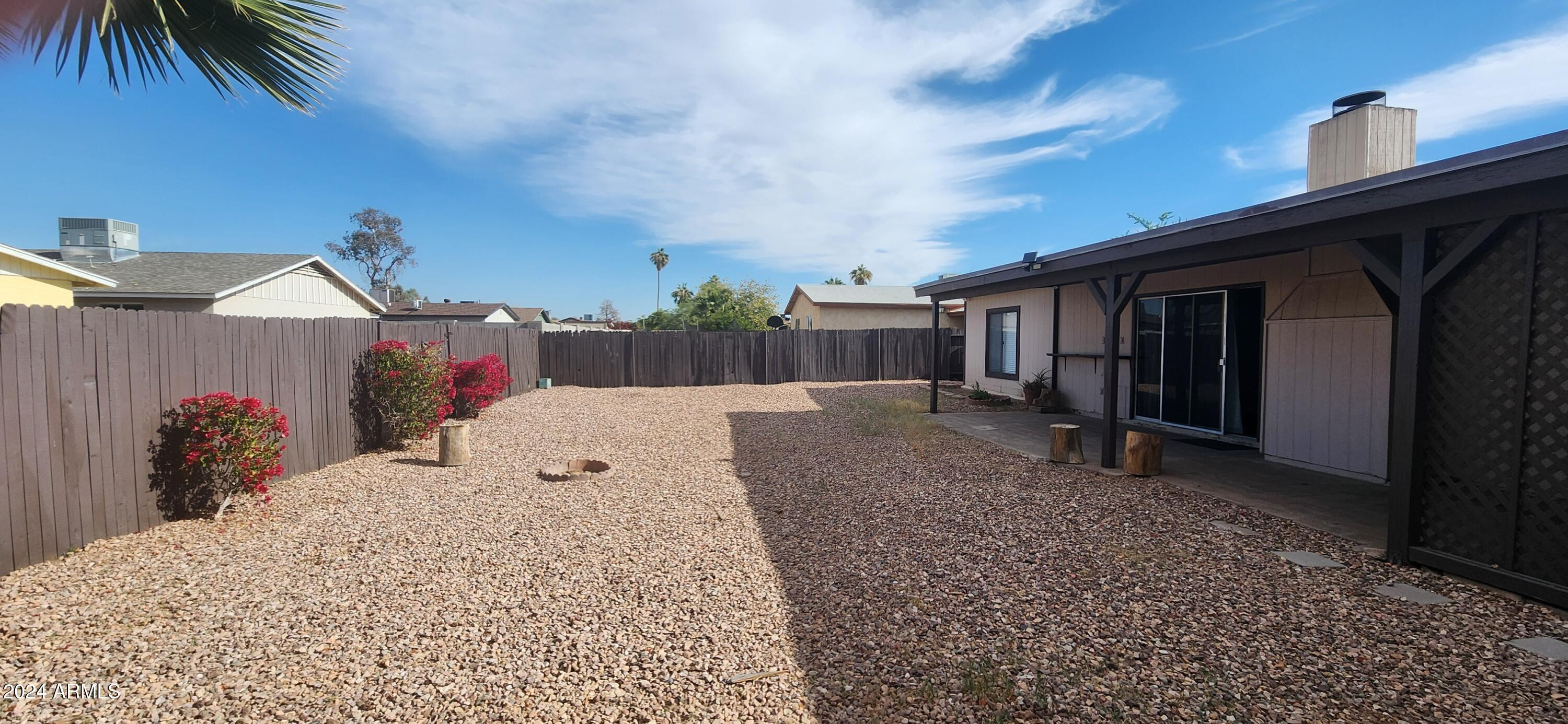 9002 West Roma Avenue Phoenix, AZ 85037 - Photo 27 of 29 a view of a house with a patio