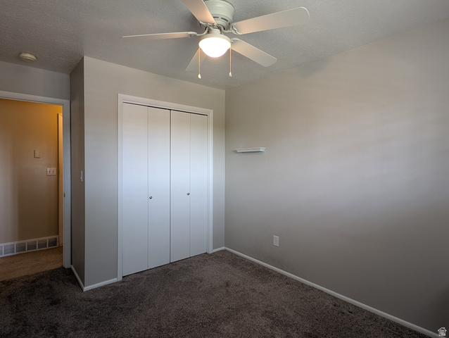 1411 Millbrook Way Bountiful, UT 84010 - Photo 25 of 36 Bedroom featuring neutral gray walls, dark gray carpeting, and a white ceiling fan with integrated lighting