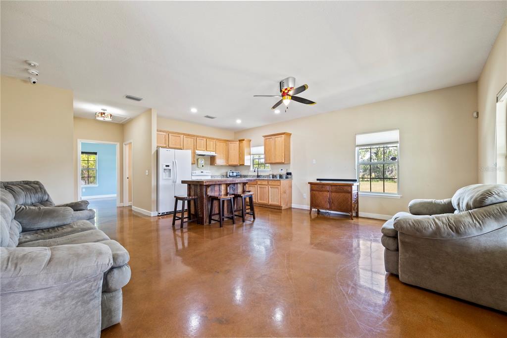 168 Southwest Poberezny Glen Lake Lake City, FL 32025 - Photo 11 of 29 a living room with furniture and kitchen view