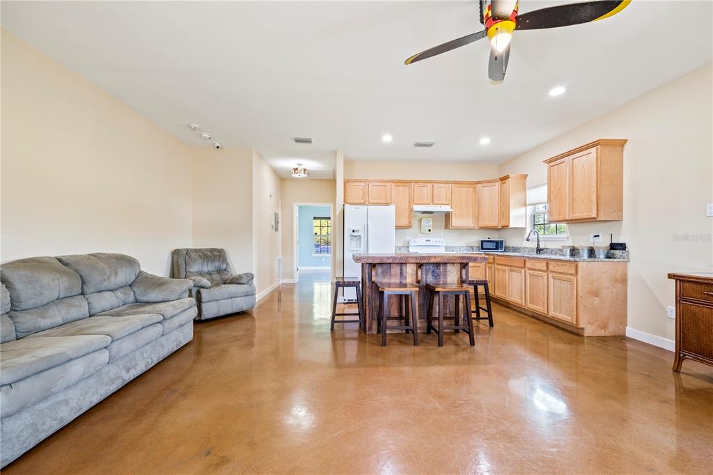 168 Southwest Poberezny Glen Lake Lake City, FL 32025 - Photo 12 of 29 a living room with furniture and kitchen view