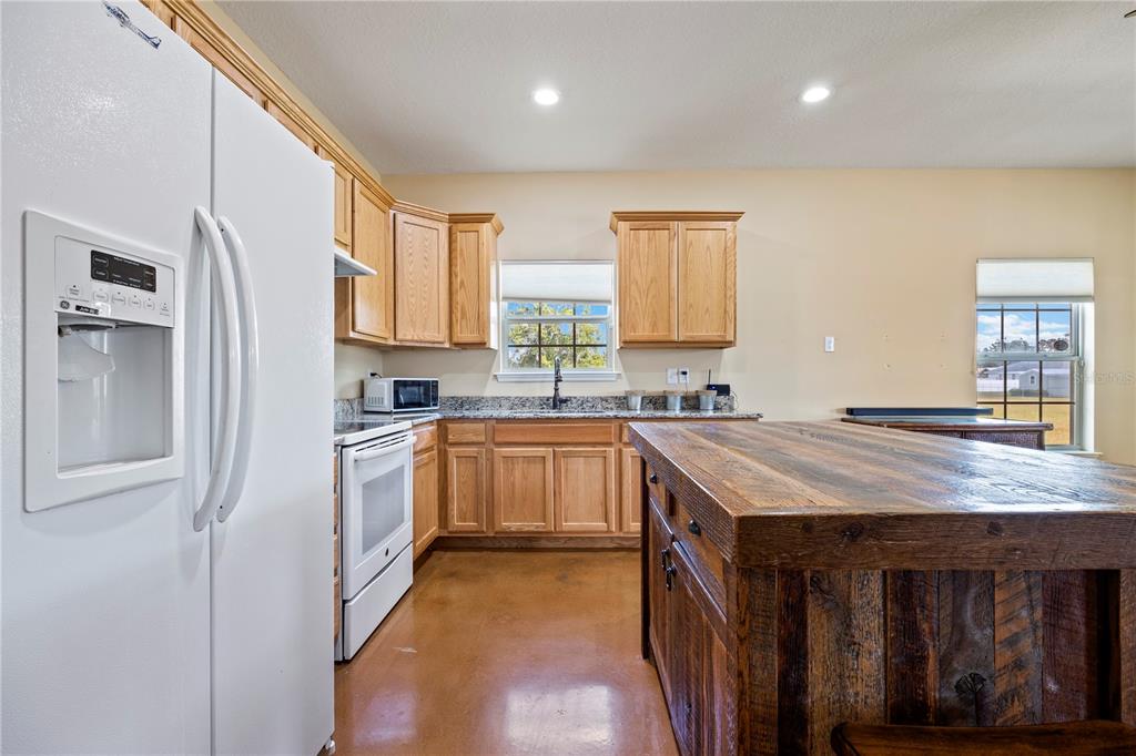168 Southwest Poberezny Glen Lake Lake City, FL 32025 - Photo 13 of 29 a kitchen with a sink stove and cabinets
