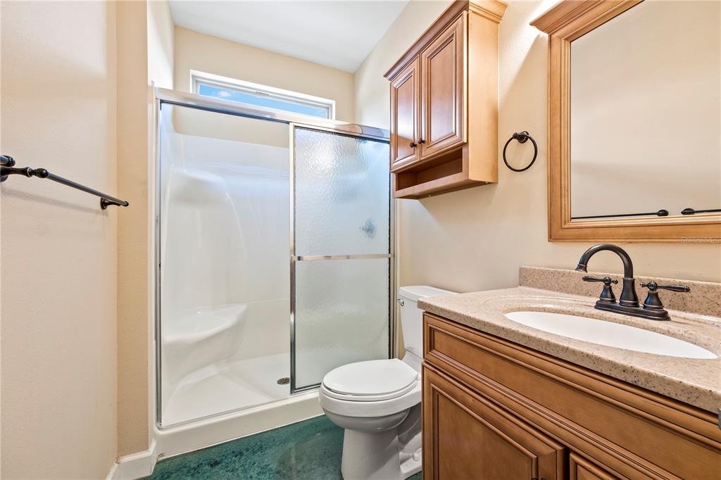 168 Southwest Poberezny Glen Lake Lake City, FL 32025 - Photo 16 of 29 a bathroom with a sink a toilet and shower