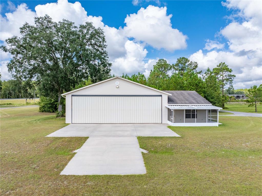 168 Southwest Poberezny Glen Lake Lake City, FL 32025 - Photo 2 of 29 a view of house with garden space and trees in the background