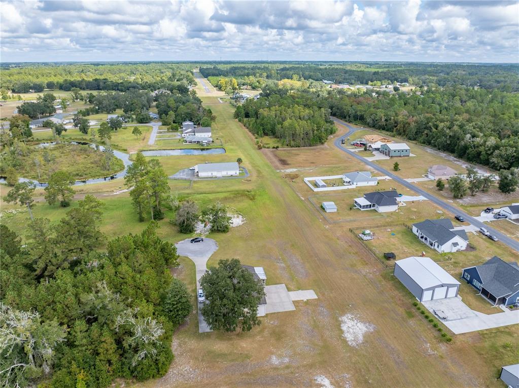 168 Southwest Poberezny Glen Lake Lake City, FL 32025 - Photo 28 of 29 an aerial view of residential houses with outdoor space