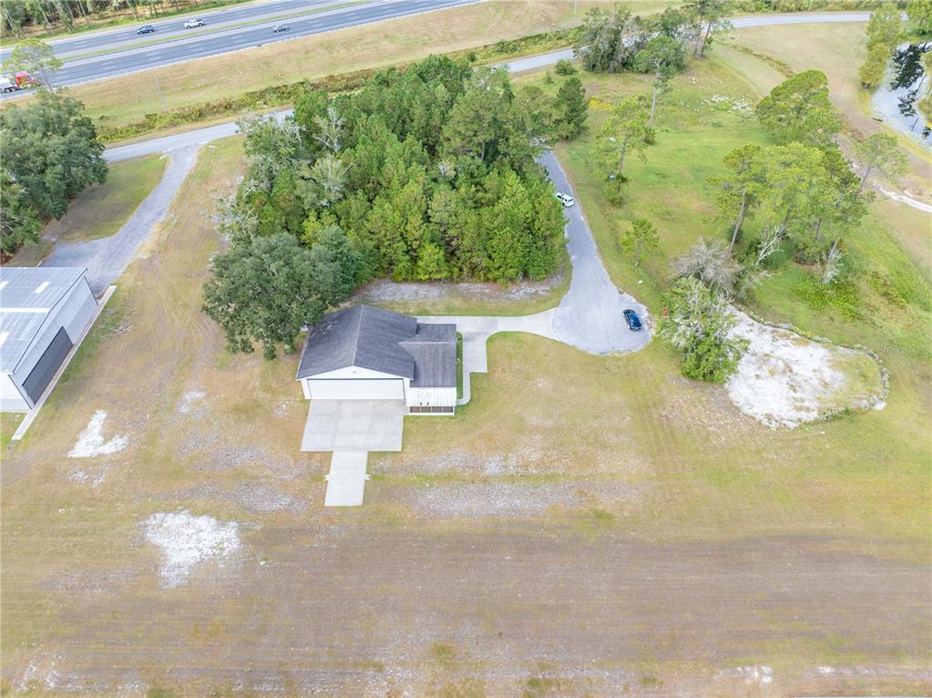 168 Southwest Poberezny Glen Lake Lake City, FL 32025 - Photo 29 of 29 a view of a garden with a fountain