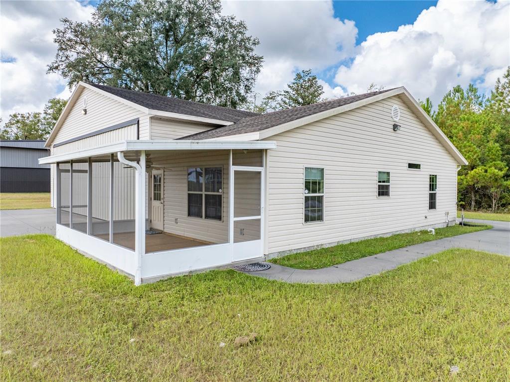 168 Southwest Poberezny Glen Lake Lake City, FL 32025 - Photo 5 of 29 a view of a house with a yard and potted plants