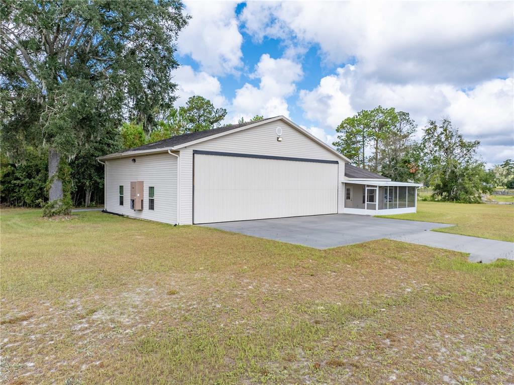 168 Southwest Poberezny Glen Lake Lake City, FL 32025 - Photo 9 of 29 a front view of house with yard and trees in the background