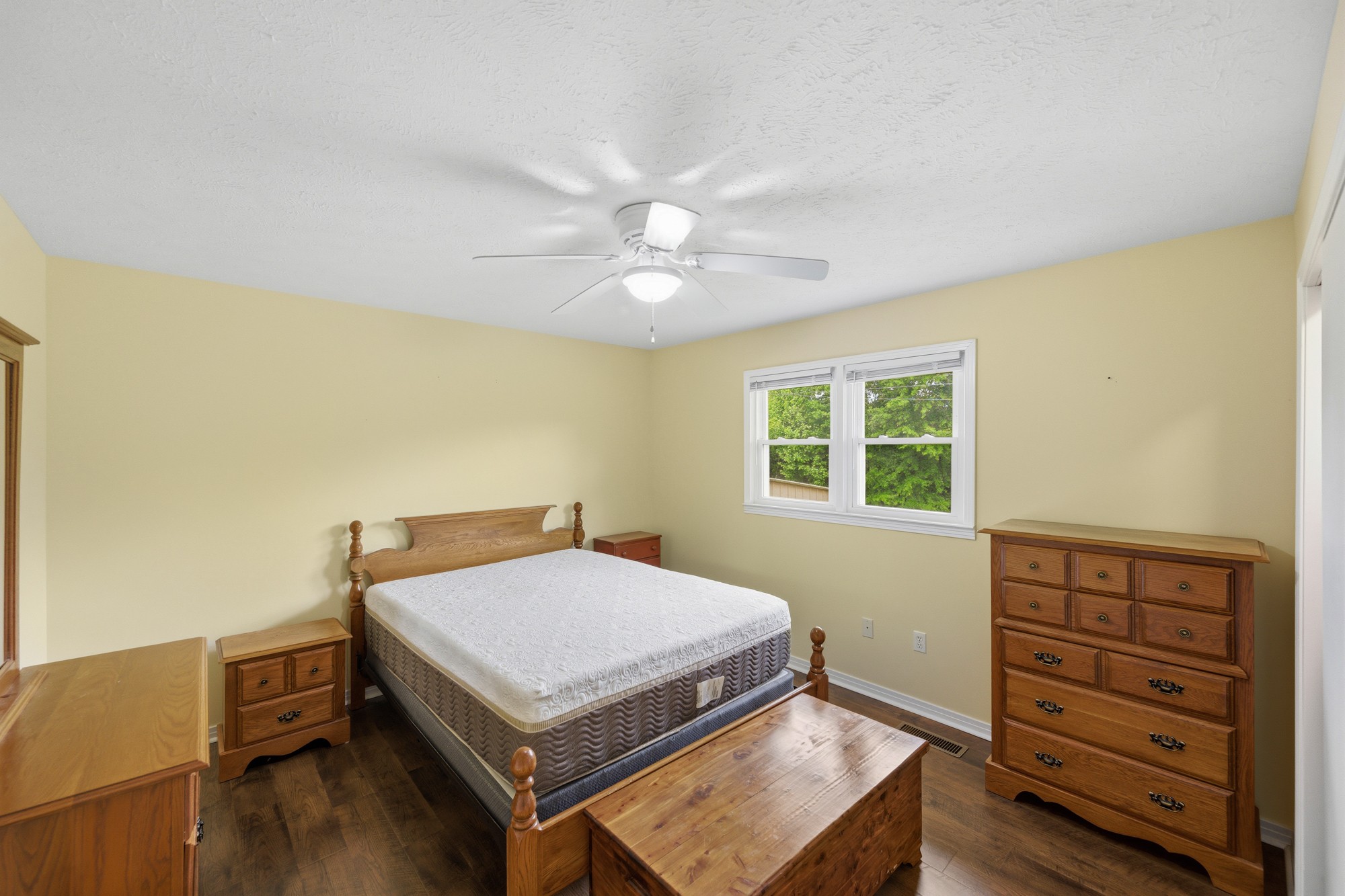 944 Brooksie Thompson Road Decaturville, TN 38329 - Photo 24 of 47 a bedroom with a bed and a window