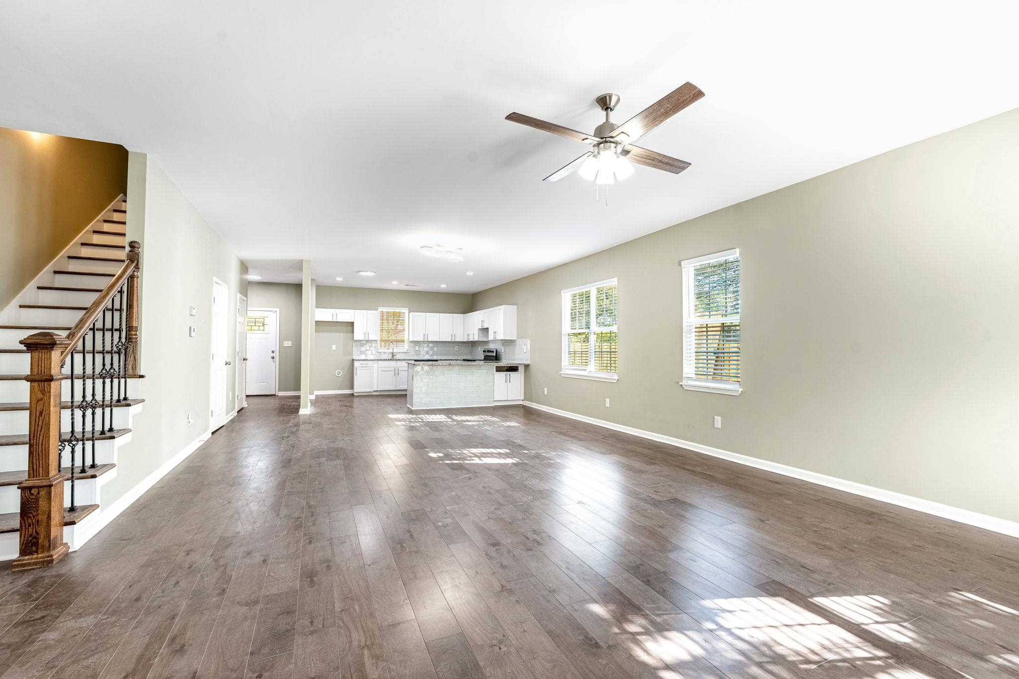 71 Clark Place Memphis, TN 38104 - Photo 2 of 11 a view of an empty room with wooden floor and a window