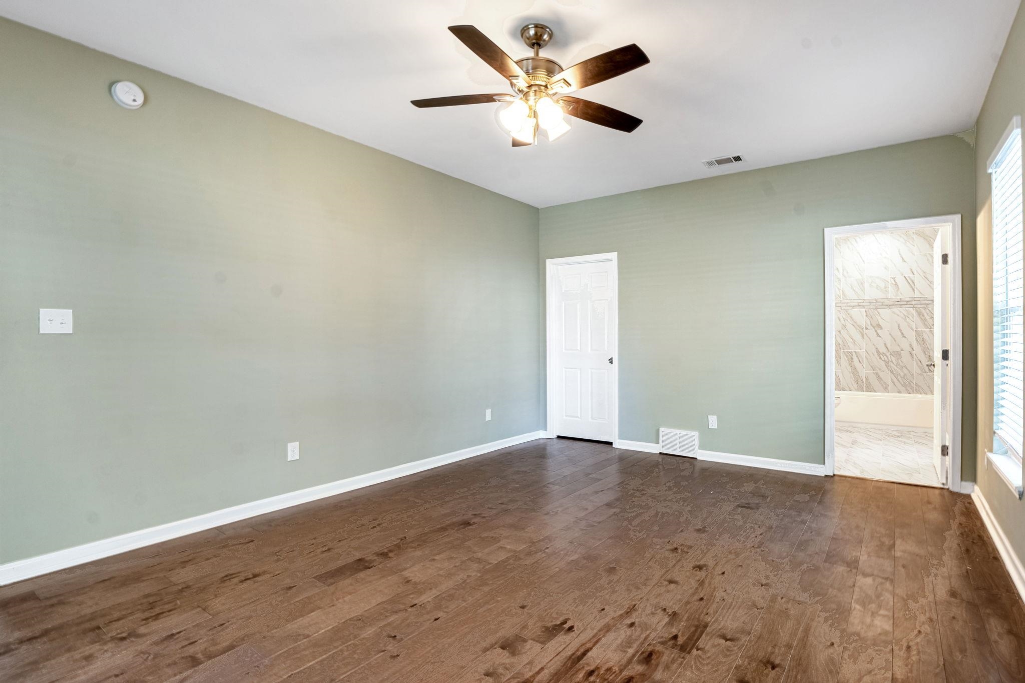 71 Clark Place Memphis, TN 38104 - Photo 5 of 11 an empty room with a window and a fan