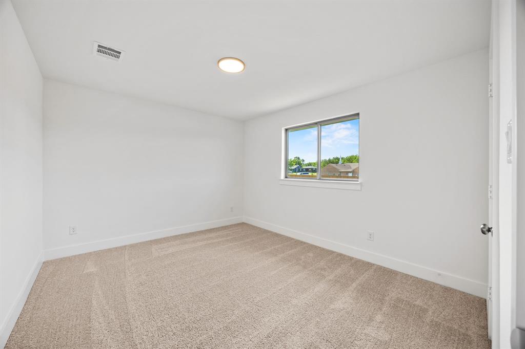 316 Chestnut Street Celina, TX 75009 - Photo 20 of 25 an empty room with windows