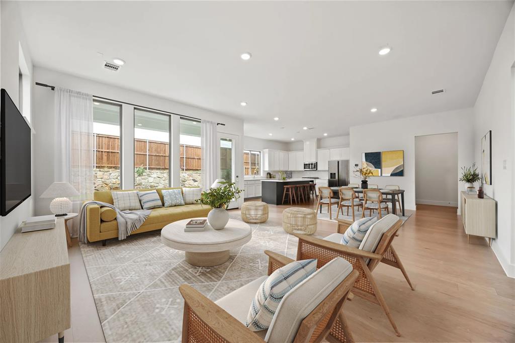 316 Chestnut Street Celina, TX 75009 - Photo 4 of 25 a living room with furniture and a flat screen tv