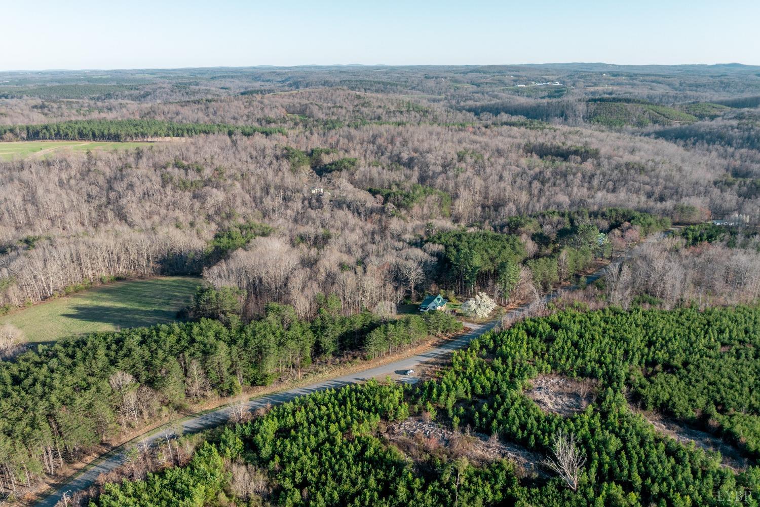 0 Armstrong Road Penhook, VA 24137 - Photo 6 of 9 an aerial view of house with green field and trees