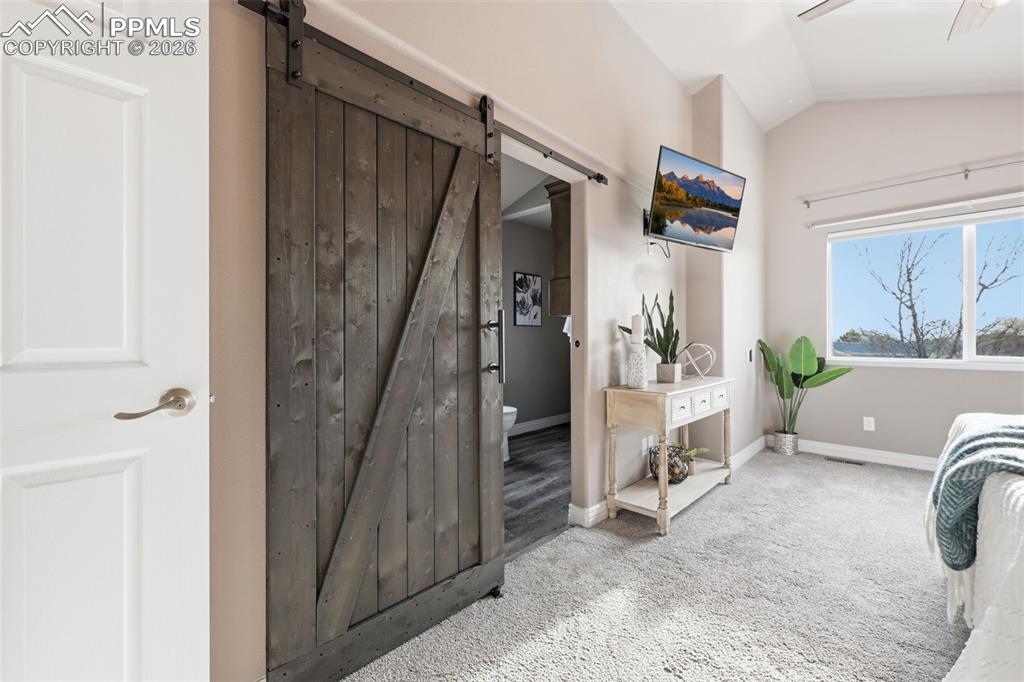 8603 Copenhagen Road Peyton, CO 80831 - Photo 23 of 50 The entrance to the ensuite bathroom. A barn door entrance adds to the appeal!