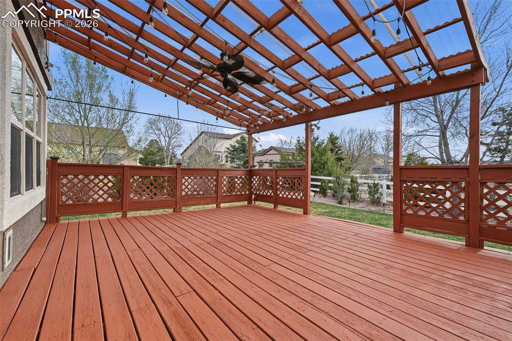 8603 Copenhagen Road Peyton, CO 80831 - Photo 36 of 50 A covered deck with a ceiling fan! Even party lights already for your next event. This space will be great for summer BBQ's!