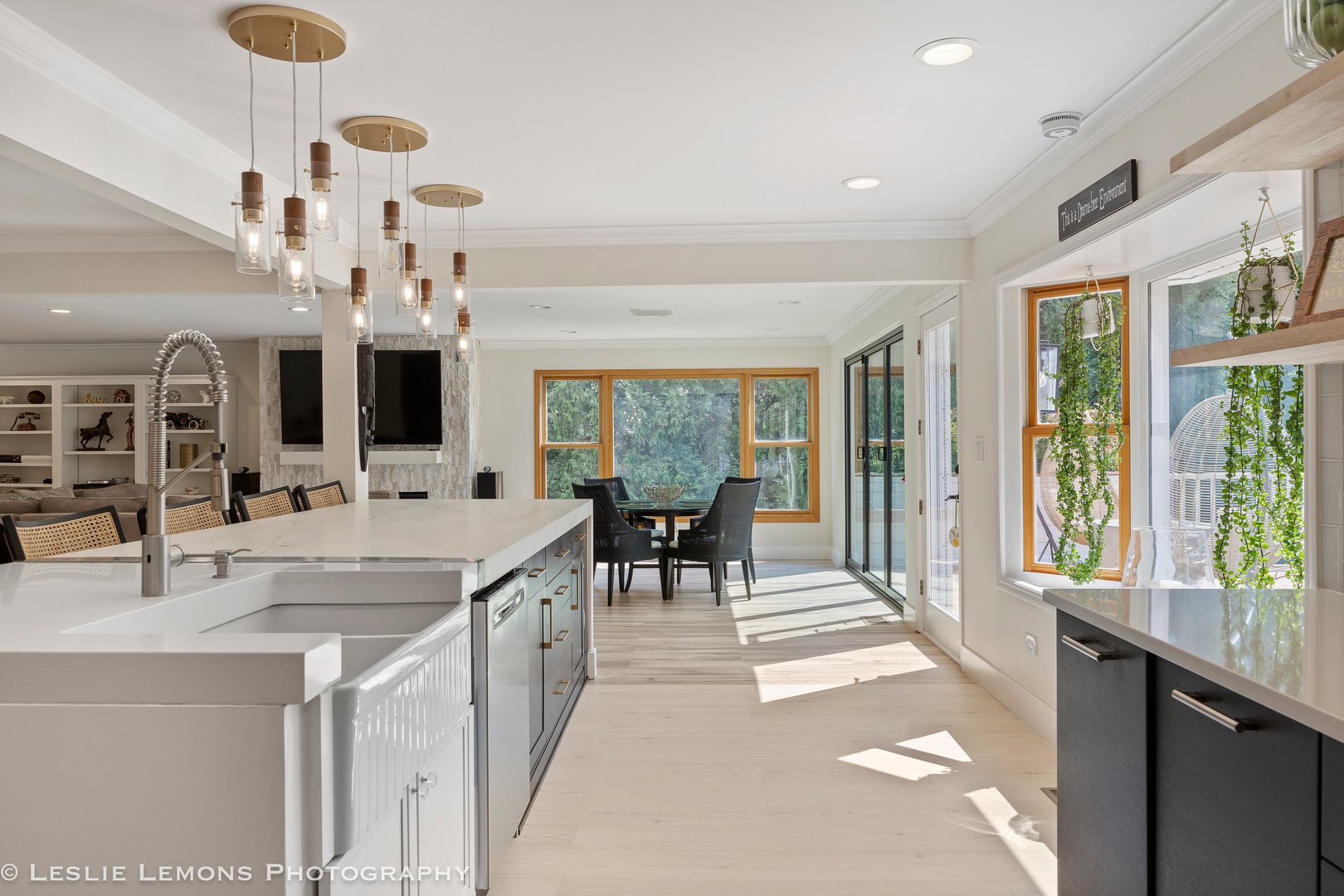 8S452 Bell Drive Naperville, IL 60565 - Photo 22 of 59 a large white kitchen with lots of counter top space and living room