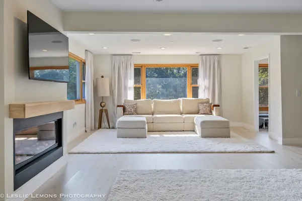 a spacious bathroom with a double vanity sink double mirror and bathtub