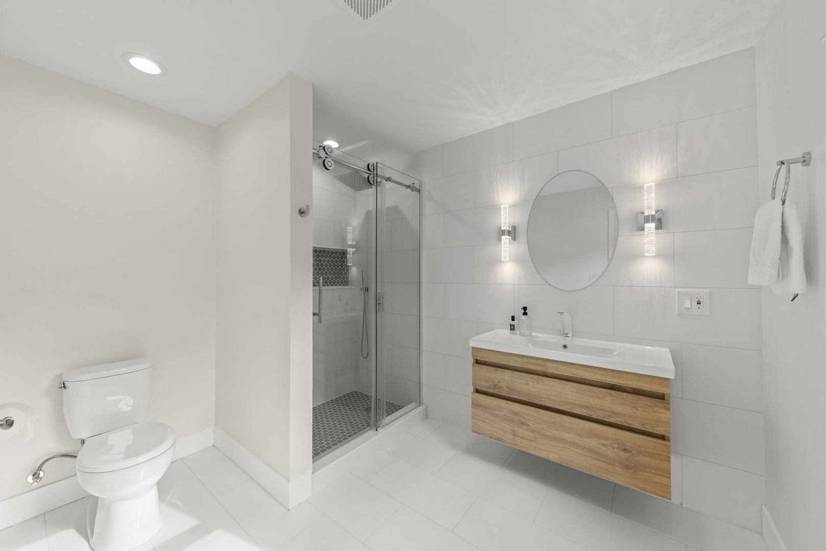 8S452 Bell Drive Naperville, IL 60565 - Photo 31 of 59 a spacious bathroom with a double vanity sink toilet mirror and shower