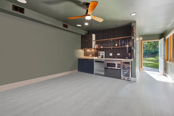 a view of a livingroom with furniture and windows
