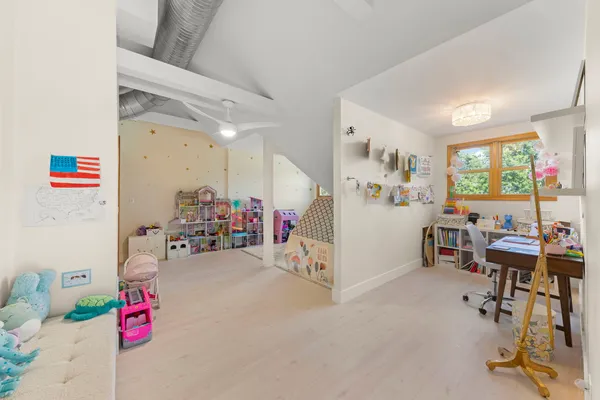 a view of a deck with table and chairs and wooden fence