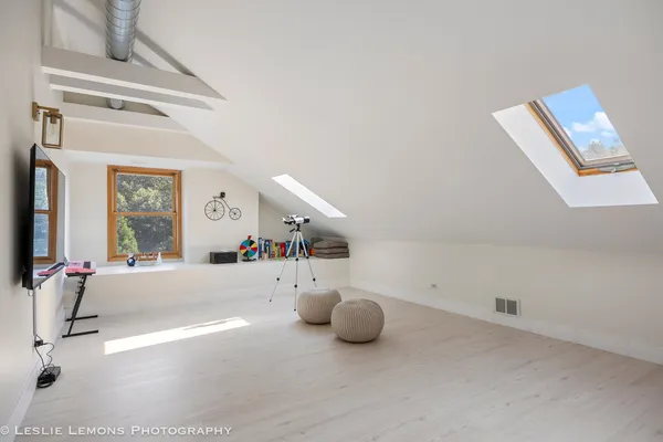 a front view of a house with a garden and yard